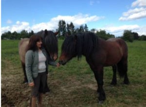 HEAL Instructor Jeanette Lysell with two horses at Human Equine Alliance